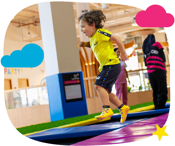 child jumping with joy on a trampoline at miniBOUNCE